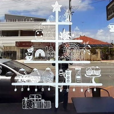 Coastal Christmas themed window illustration in cafe