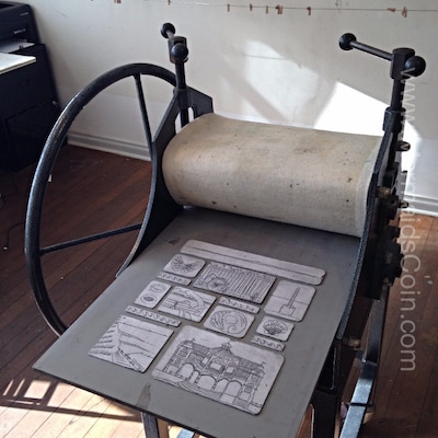 A traditional etching press with printing plates