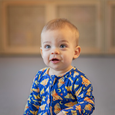 Cute toddler in moth jumpsuit