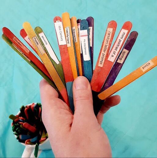 coloured popsicle sticks used for art prompts